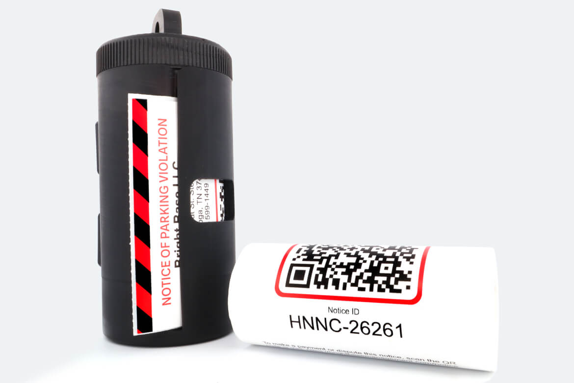 Ticket dispenser with roll of tickets.